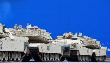 U.S. tanks, trucks and other military equipment, which arrived by ship, are unloaded in the harbour of Bremerhaven, Germany, January 8, 2017. PHOTO BY REUTERS/Fabian Bimmer