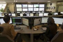 Technicians monitor data flow in the control room of an internet service provider in Tehran, February 15, 2011. PHOTO BY REUTERS/Caren Firouz