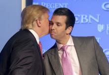 U.S. Republican presidential candidate Donald Trump kisses his son Donald, Jr. at a campaign event at Regents University in Virginia Beach, Virginia, February 24, 2016. PHOTO BY REUTERS/Joshua Roberts