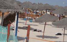 The corpse of a suicide bomber, who blew himself up, lies on a beach near the tourist resort of Sousse