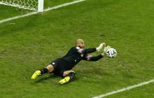 Goalkeeper Tim Howard of the U.S. saves a shot during their 2014 World Cup round of 16 game against Belgium at the Fonte Nova arena in Salvador