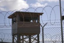 A soldier stands guard in a tower overlooking Camp Delta at Guantanamo Bay naval base in a December 31, 2009 file photo. PHOTO BY REUTERS/US Navy