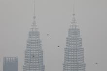 Petronas Twin Towers are shrouded by haze in Kuala Lumpur, Malaysia, September 9, 2019. PHOTO BY REUTERS/Lim Huey Teng