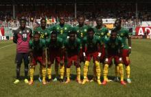 Cameroon's players pose for a team photo before their African Nations Cup qualifying soccer match against Ivory Coast at the Felix Houphouet Boigny stadium in Abidjan, November 19, 2014. PHOTO BY REUTERS/Luc Gnago