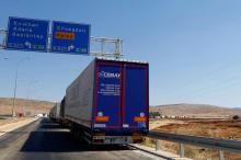 Commercial Turkish trucks wait to cross to Syria near the Cilvegozu border gate, located opposite the Syrian commercial crossing point Bab al-Hawa in Reyhanli, Hatay province, Turkey, September 16, 2016. PHOTO BY REUTERS/Osman Orsal