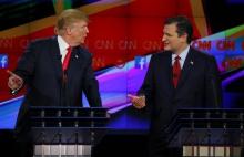 Republican U.S. presidential candidate businessman Donald Trump and Senator Ted Cruz (R) speak during the Republican presidential debate in Las Vegas, Nevada, December 15, 2015. PHOTO BY REUTERS/Mike Blake