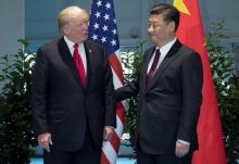 U.S. President Donald Trump and Chinese President Xi Jinping (R) meet on the sidelines of the G20 Summit in Hamburg, Germany, July 8, 2017. PHOTO BY REUTERS/Saul Loeb