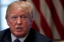 U.S. President Donald Trump receives a briefing from senior military leadership at the Cabinet Room of the White House in Washington, DC, U.S., April 9, 2018. PHOTO BY REUTERS/Carlos Barria
