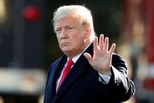 U.S. President Donald Trump waves prior to departing on a trip to Wisconsin from the White House in Washington, U.S., October 24, 2018. PHOTO BY REUTERS/Cathal McNaughton