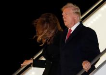 U.S. President Donald Trump and first lady Melania Trump exit Air Force One as they arrive at Orly Airport near Paris to attend commemoration ceremonies for Armistice Day, 100 years after the end of the First World War, France, November 9, 2018. PHOTO BY REUTERS/Carlos Barria