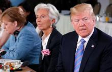 U.S. President Donald Trump, Managing Director of the International Monetary Fund Christine Lagarde and Germany's Chancellor Angela Merkel attend a G7 and Gender Equality Advisory Council meeting as part of a G7 summit in the Charlevoix city of La Malbaie, Quebec, Canada, June 9, 2018. PHOTO BY REUTERS/Yves Herman