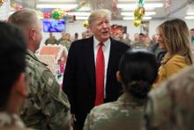 U.S. President Donald Trump and First Lady Melania Trump greet military personnel at the dining facility during an unannounced visit to Al Asad Air Base, Iraq, December 26, 2018. PHOTO BY REUTERS/Jonathan Ernst