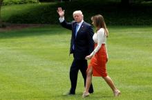 U.S. President Donald Trump and Melania Trump depart the White House to embark on a trip to the Middle East and Europe, in Washington, U.S., May 19, 2017. PHOTO BY REUTERS/Kevin Lamarque