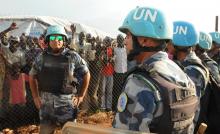 U.N. peacekeepers stand guard at a demonstration by people in Jebel, near South Sudan's capital Juba, September 3, 2016. PHOTO BY REUTERS/Jok Solomun