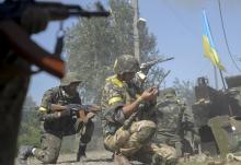 Ukrainian servicemen are seen at their position during fighting with pro-Russian separatists in the eastern Ukrainian town of Ilovaysk