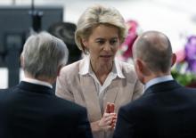 German Defense Minister Ursula von der Leyen (C) talks with participants during the 51st Munich Security Conference at the 'Bayerischer Hof' hotel in Munich, February 7, 2015. PHOTO BY REUTERS/Michaela Rehle