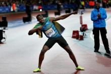 Jamaica's Usain Bolt celebrates after winning the Men's 100m Final Action. PHOTO BY REUTERS/Matthew Childs