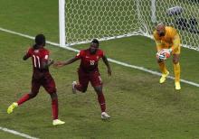 Portugal's Varela (C) celebrates scoring their second goal with team mate Eder (L) during their 2014 World Cup G soccer match against USA at the Amazonia arena in Manaus