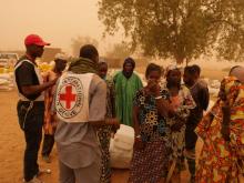 Villagers are seen following the March 23 attack by militiamen that killed about 160 Fulani people. PHOTO BY REUTERS/ICRC 