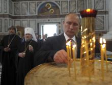 Russian President Vladimir Putin attends an Orthodox service in St. Vladimir's Cathedral in Sevastopol