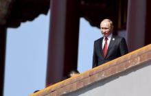 Russia's President Vladimir Putin is seen on the Tiananmen Gate, at the beginning of the military parade marking the 70th anniversary of the end of World War Two, in Beijing, China, September 3, 2015. PHOTO BY REUTERS/cnsphoto