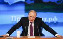 Russian President Vladimir Putin speaks during his annual end-of-year news conference in Moscow, December 18, 2014. PHOTO BY REUTERS/Maxim Zmeyev