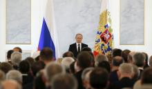 Russian President Vladimir Putin addresses the Federal Assembly, including State Duma deputies, members of the Federation Council, regional governors and civil society representatives, at the Kremlin in Moscow, Russia, December 3, 2015. PHOTO BY REUTERS/Sergei Karpukhin