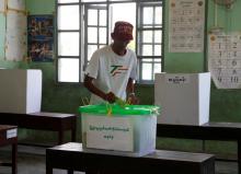 A man puts his ballot into a ballot box at a polling station as he vote during by-elections in Yangon, Myanmar, April 1, 2017. PHOTO BY REUTERS/Soe Zeya Tun
