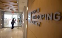 A woman walks into the head office for the World Anti-Doping Agency (WADA) in Montreal, November 9, 2015. PHOTO BY REUTERS/Christinne Muschi