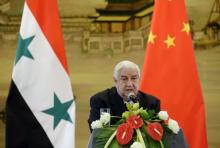 Syria's Foreign Minister Walid al-Moualem speaks during a joint news conference with China's Foreign Minister Wang Yi (not seen) after a meeting at the Ministry of Foreign Affairs in Beijing, China, December 24, 2015. PHOTO BY REUTERS/Jason Lee