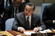 China's Foreign Minister Wang Yi speaks to members of the Security Council at the United Nations Headquarters in Manhattan, New York, December 18, 2015. PHOTO BY REUTERS/Eduardo Munoz