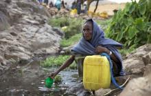 A woman collects water from a stream outside the village of Tsemera in Ethiopia's northern Amhara region, February 13, 2016. PHOTO BY REUTERS/Katy Migiro
