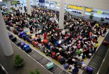 Overseas Filipino Workers (OFW) from Kuwait gather upon arrival at the Ninoy Aquino International Airport in Pasay city, Metro Manila, Philippines, February 21, 2018. PHOTO BY REUTERS/Romeo Ranoco