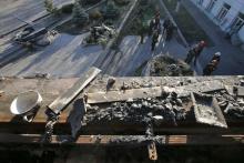 Workers stand at coal mine number 22 "Kommunar" in the village of Nizhnyaya Krynka, east of Donetsk, November 6, 2014. PHOTO BY REUTERS/Maxim Zmeyev