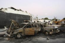 The wreckage of destroyed cars is seen at the scene of an explosion in Waabari district of Somalia's capital Mogadishu, January 4, 2015. PHOTO BY REUTERS/Feisal Omar