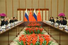 Chinese President Xi Jinping (R) speaks with Russian President Vladimir Putin (L) during a bilateral meeting at Diaoyutai State Guesthouse in Beijing, China, 14 May 2017. PHOTO BY REUTERS/Wu Hong