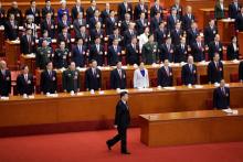 Chinese President Xi Jinping walks to take an oath, after he is voted as the president for another term, at the fifth plenary session of the National People's Congress (NPC) at the Great Hall of the People in Beijing, China, March 17, 2018. PHOTO BY REUTERS/Jason Lee