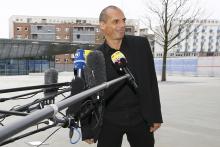 Greek Finance Minister Yanis Varoufakis smiles as he speaks to media outside the European Central Bank (ECB) in Frankfurt, February 4, 2015. PHOTO BY REUTERS/Kai Pfaffenbach