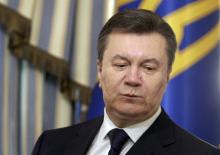 Ukraine's President Viktor Yanukovich looks on during a signing ceremony of an EU-mediated peace deal with opposition leaders at the presidential headquarters in Kiev 
