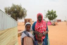Aminetou Mint Yarg poses with family members in the commune of Dar El Barka, Mauritania, October 20, 2018. PHOTO BY Thomson Reuters Foundation/Nellie Peyton