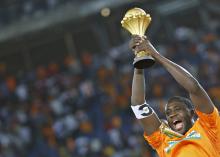 Ivory Coast's captain Yaya Toure raises the trophy after winning the African Nations Cup final soccer match against Ghana in Bata, February 8, 2015. PHOTO BY REUTERS/Amr Abdallah Dalsh