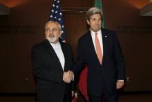 U.S. Secretary of State John Kerry (R) meets with Iran's Foreign Minister Mohammad Javad Zarif at the United Nations Headquarters in New York City, U.S., April 19, 2016. PHOTO BY REUTERS/Brendan McDermid
