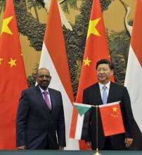 Sudanese President Omar Hassan al-Bashir (L) attends a signing ceremony with Chinese President Xi Jinping at the Great Hall of the People in Beijing, China, September 1, 2015. PHOTO BY REUTERS/Parker Song