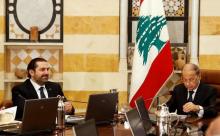 Lebanon's President Michel Aoun and Prime Minister Saad al-Hariri (L) attend the first meeting of the new cabinet at the presidential palace in Baabda, Lebanon, January 4, 2017. PHOTO BY REUTERS/Mohamed Azakir